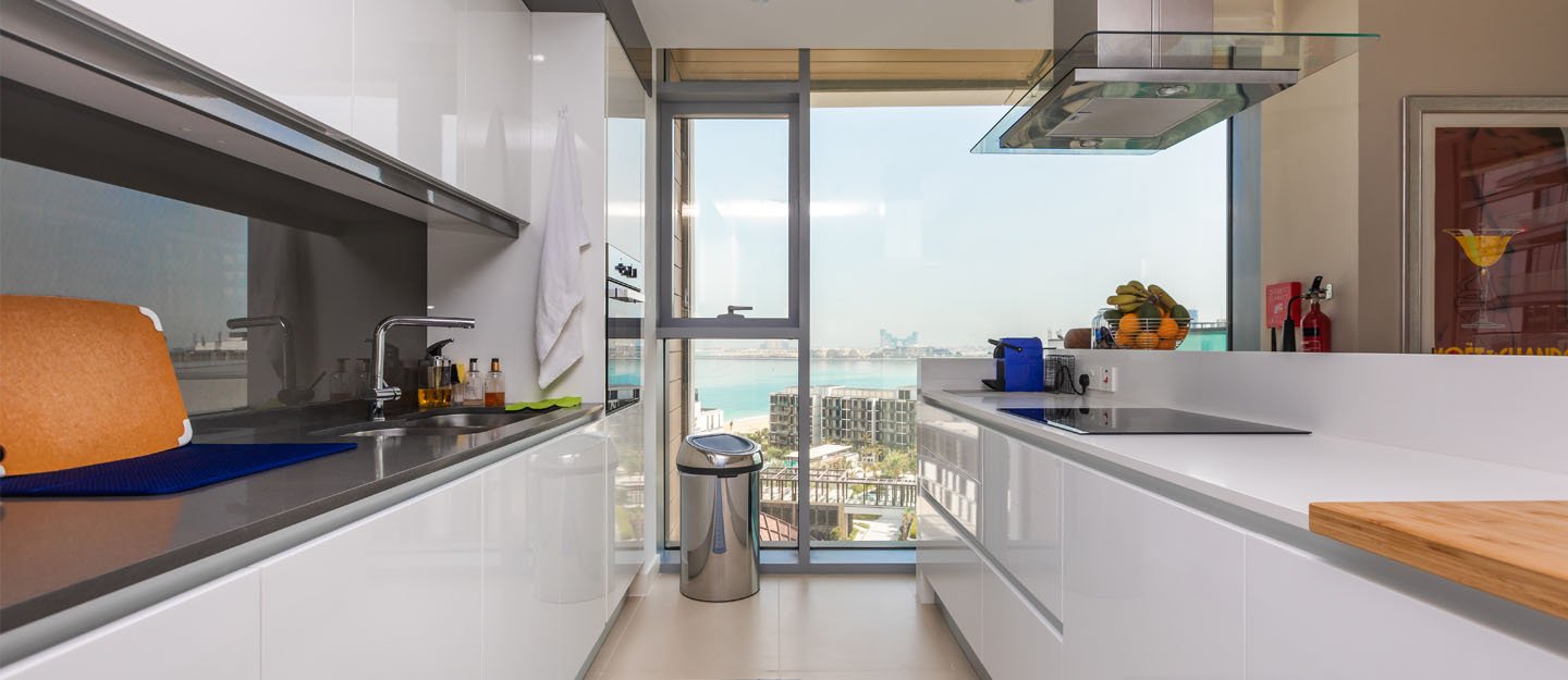 Modern kitchen renovation in Dubai with new cabinets, flooring and lighting